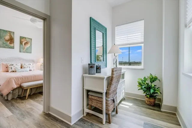 a view of living room filled with furniture and wooden floor
