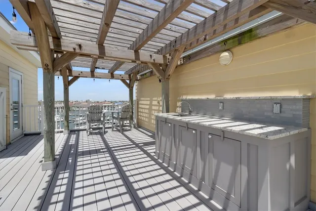 a view of a balcony with wooden floor