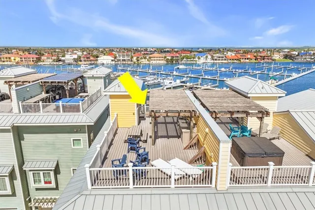 a view of a balcony with wooden floor and city view