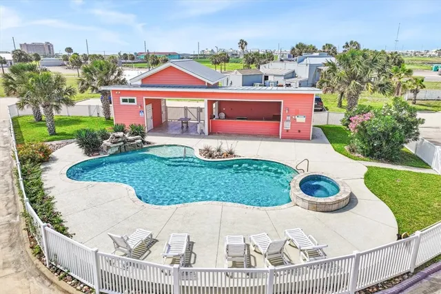 a view of a house with a yard and garage