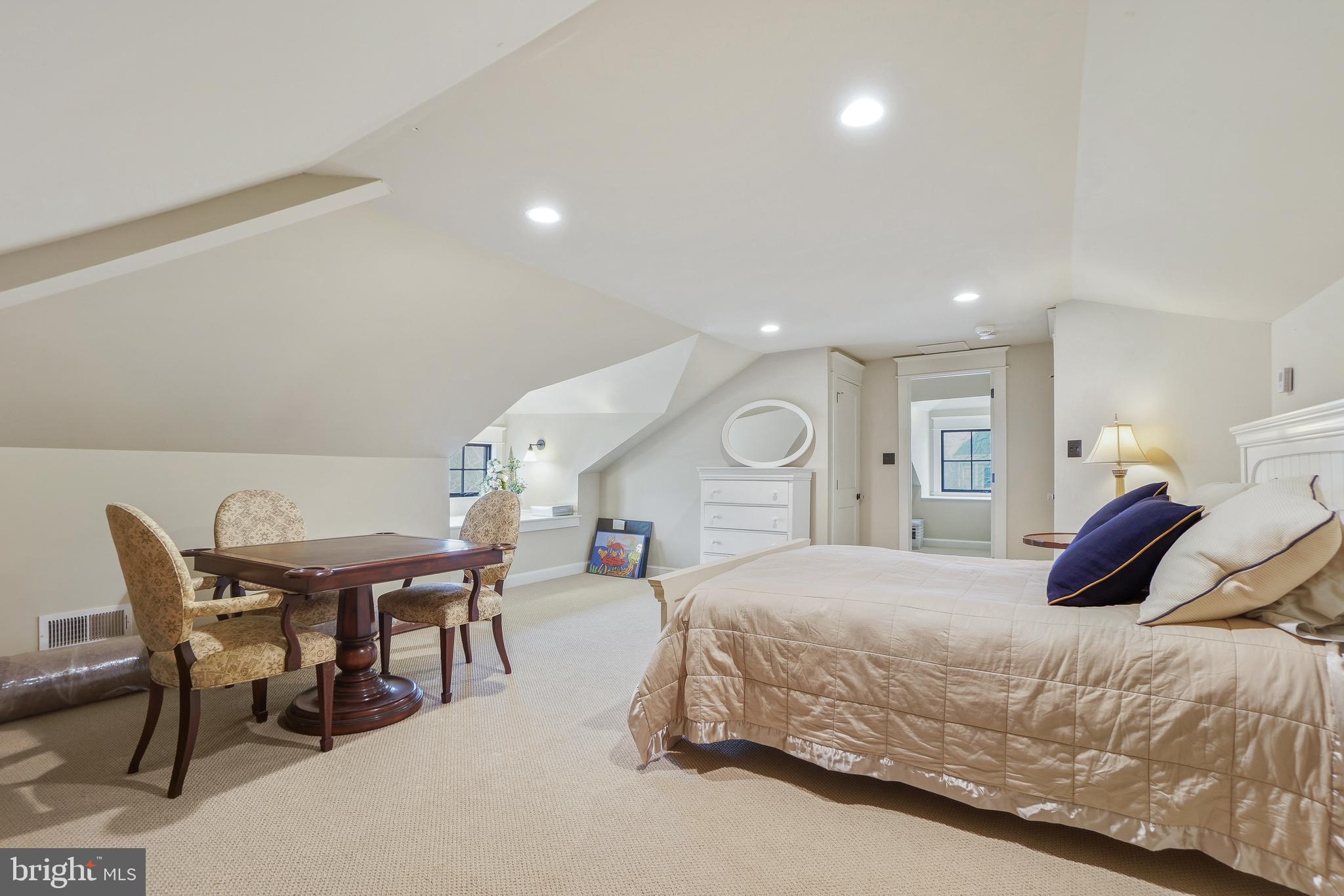 4201 Military Road Northwest Washington, DC 20015 - Photo 25 of 49 a bedroom with a bed a table and chairs