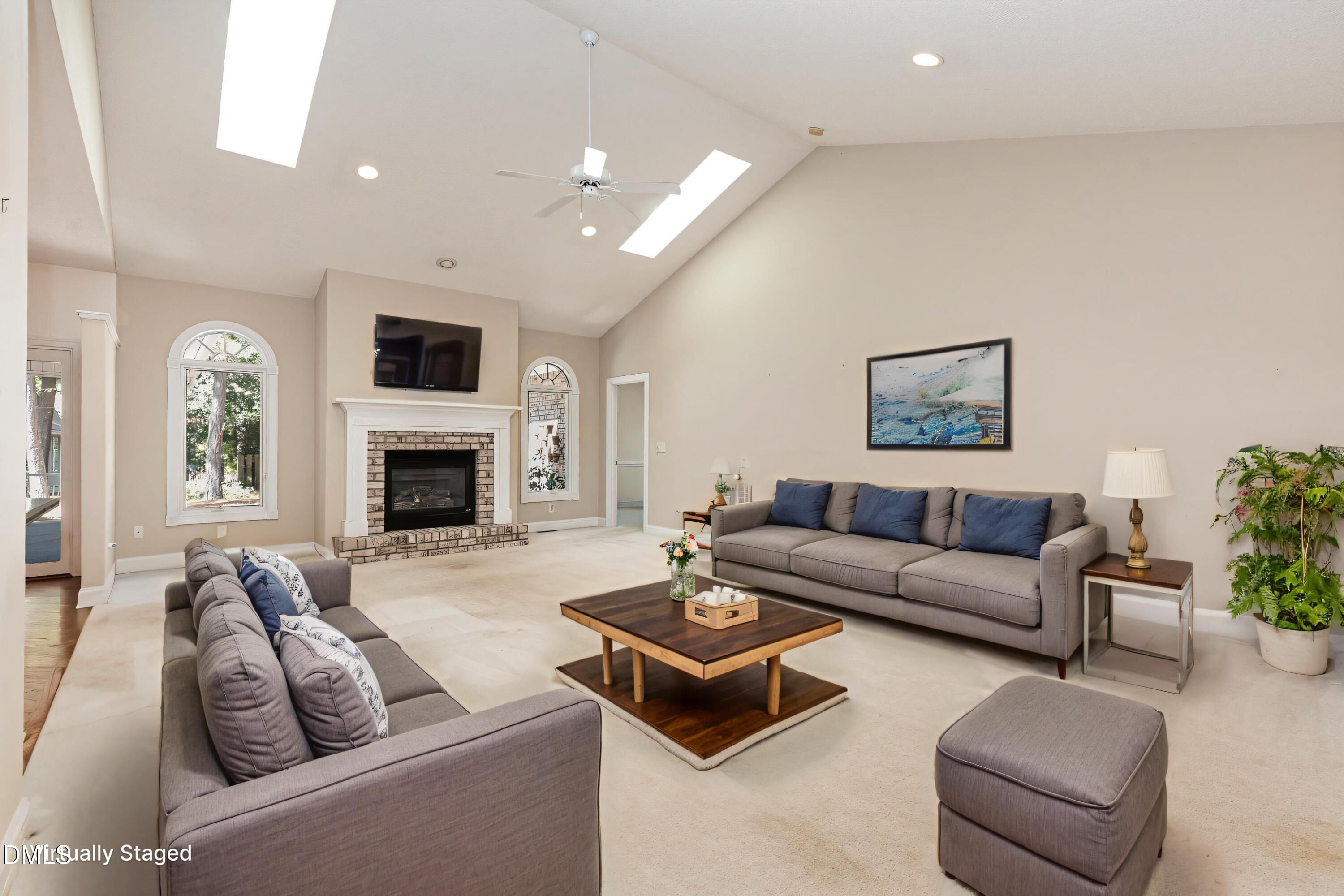 5 Pinyon Lane Pinehurst, NC 28374 - Photo 13 of 37 a living room with furniture a fireplace and a flat screen tv