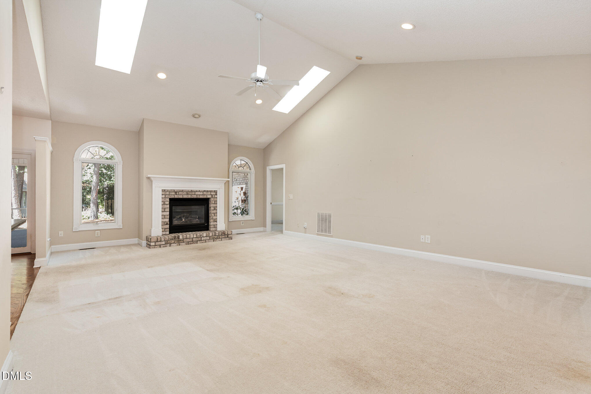 5 Pinyon Lane Pinehurst, NC 28374 - Photo 14 of 37 an empty room with fireplace and a window