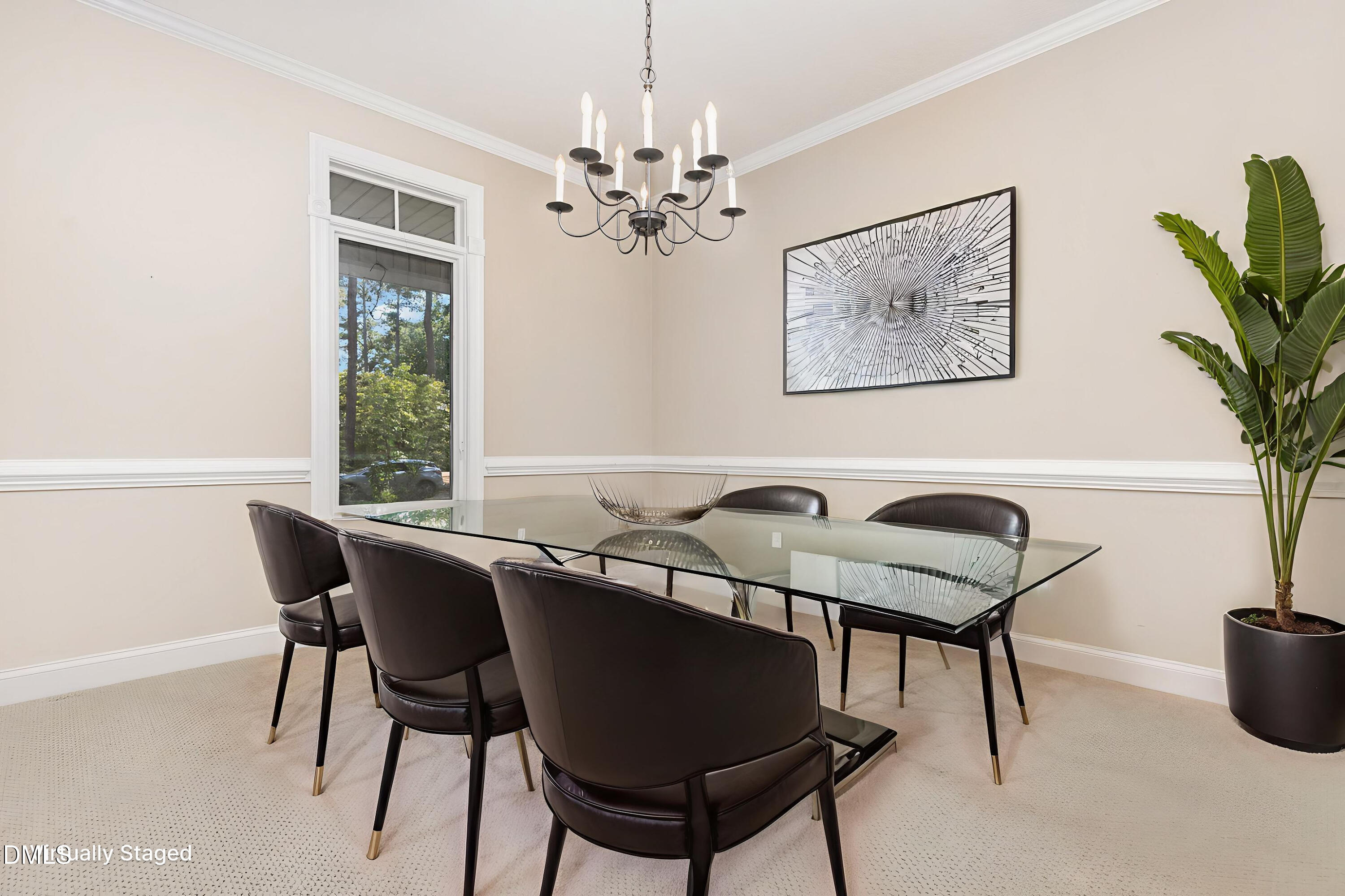 5 Pinyon Lane Pinehurst, NC 28374 - Photo 17 of 37 a view of a dining room with furniture and a potted plant