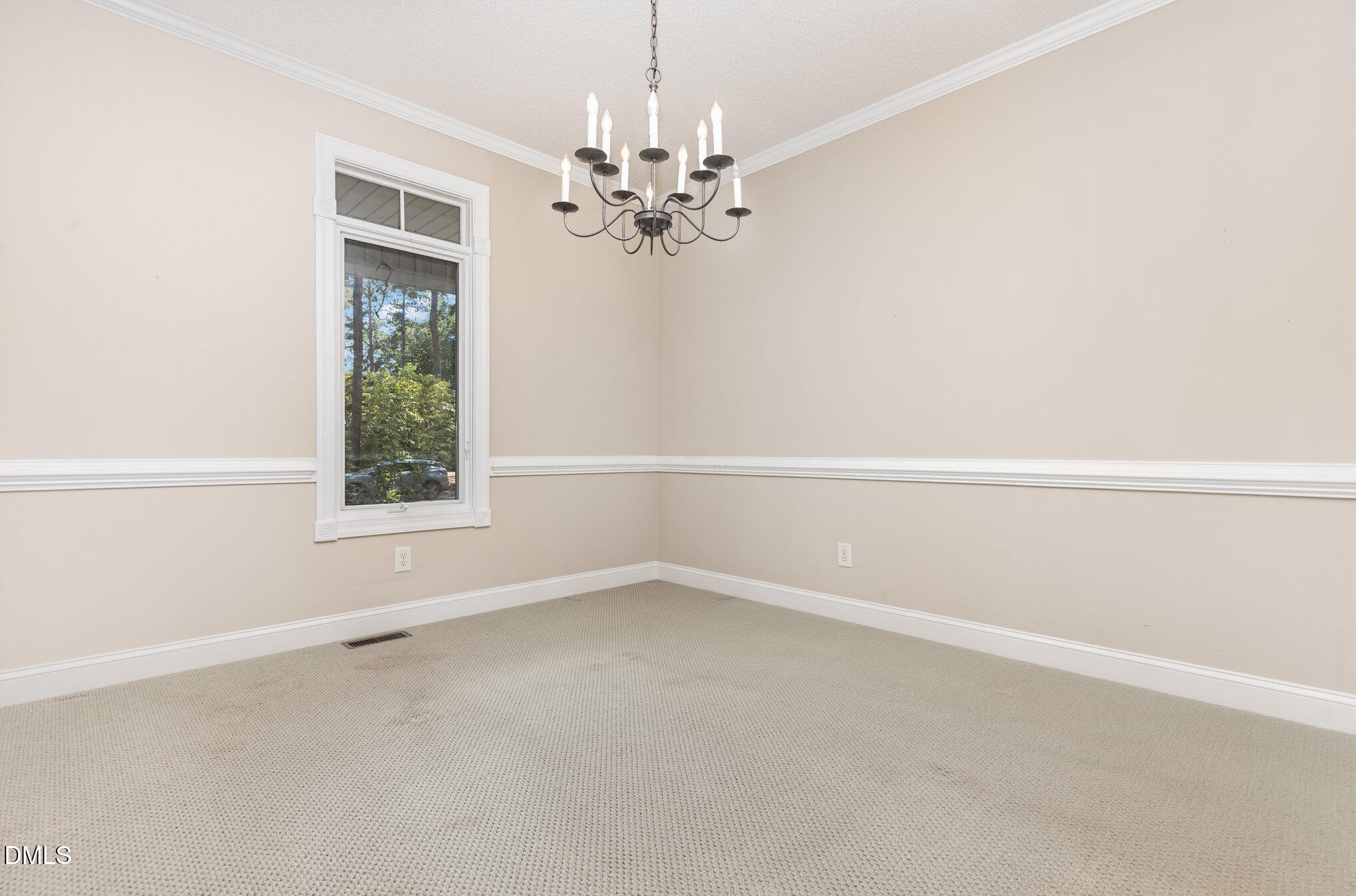 5 Pinyon Lane Pinehurst, NC 28374 - Photo 18 of 37 an empty room with windows and chandelier fan