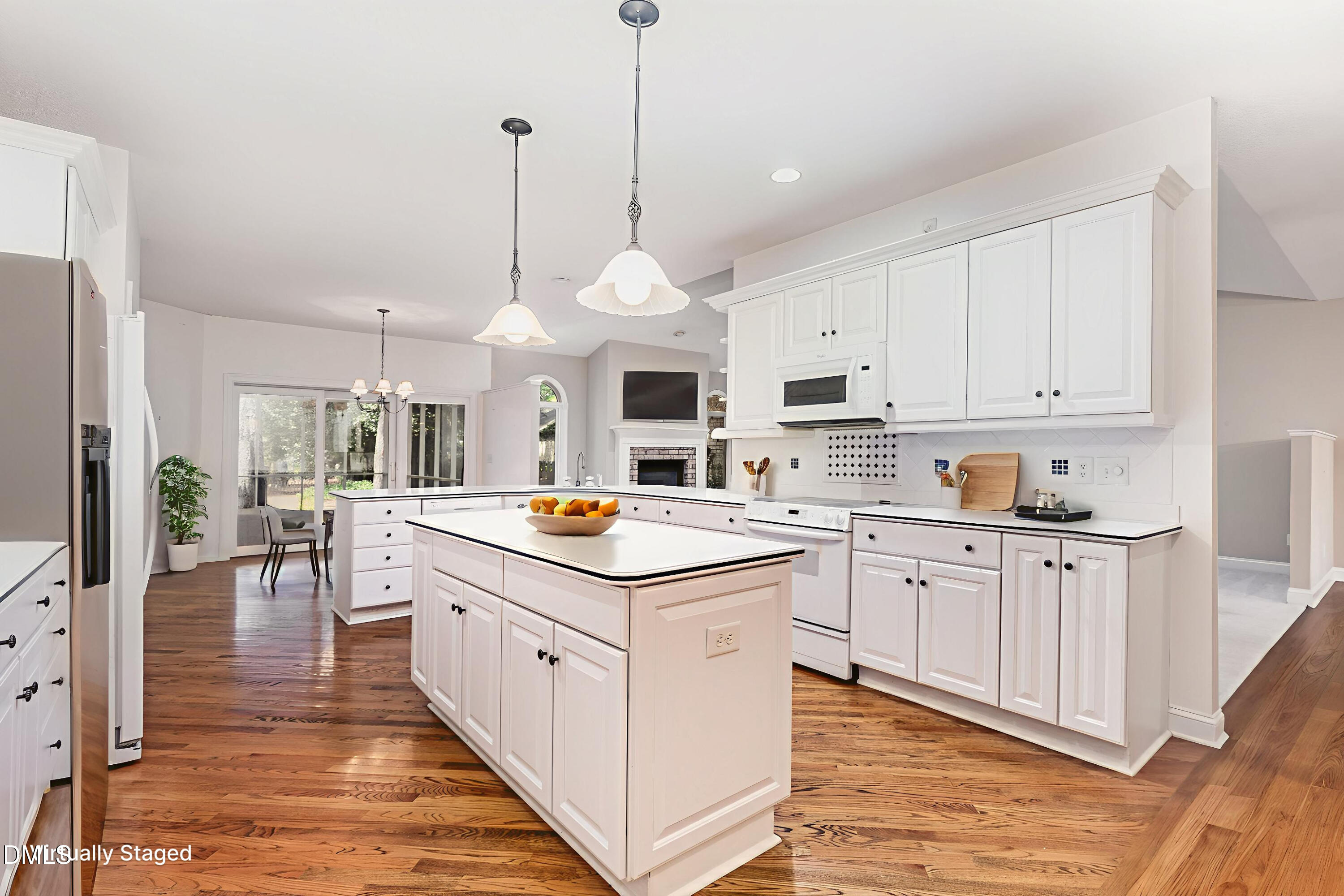 5 Pinyon Lane Pinehurst, NC 28374 - Photo 20 of 37 a kitchen with stainless steel appliances granite countertop a sink and a wooden floors