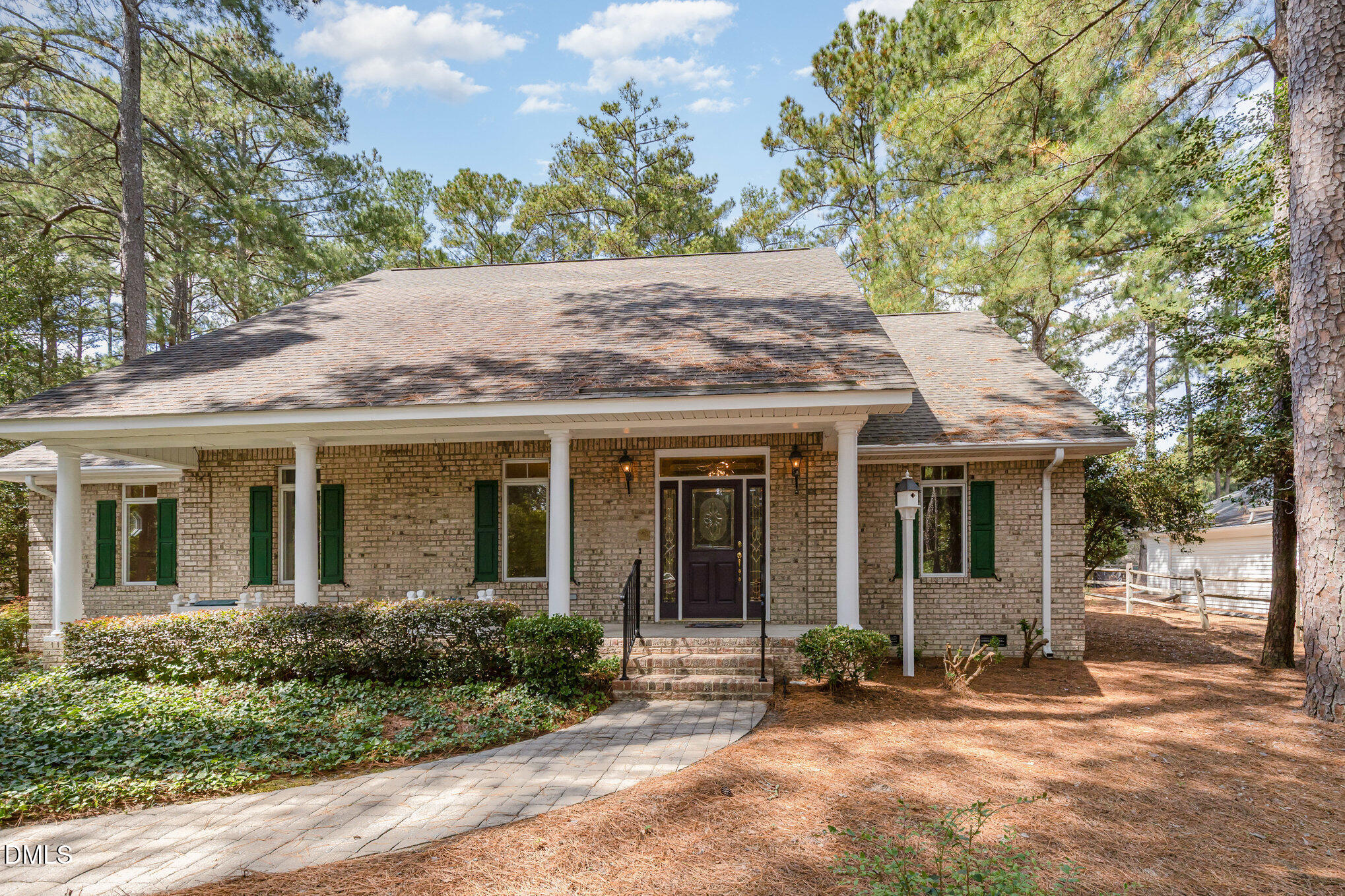 5 Pinyon Lane Pinehurst, NC 28374 - Photo 2 of 37 front view of a house with a garden