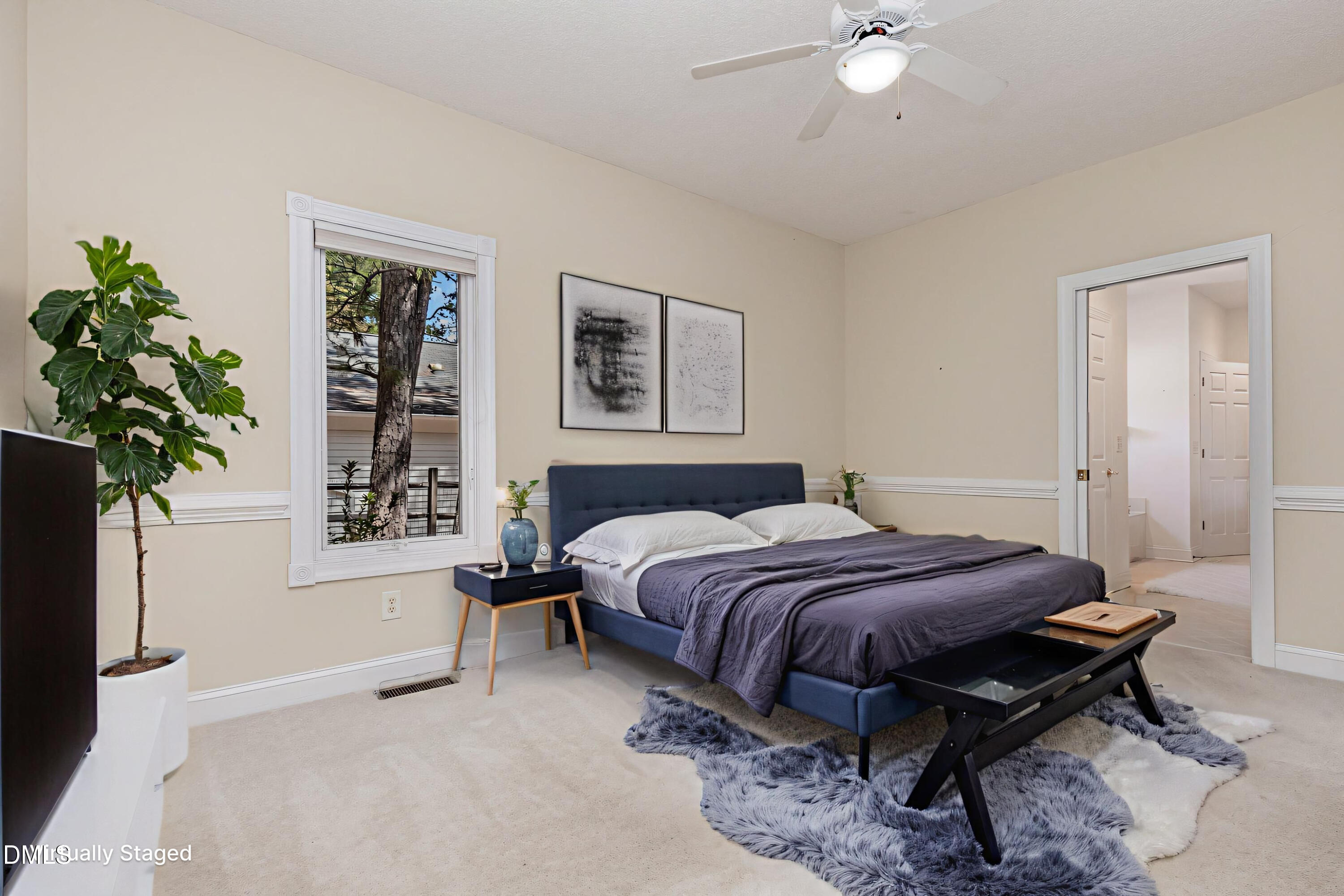 5 Pinyon Lane Pinehurst, NC 28374 - Photo 25 of 37 a spacious bedroom with a bed and a potted plant
