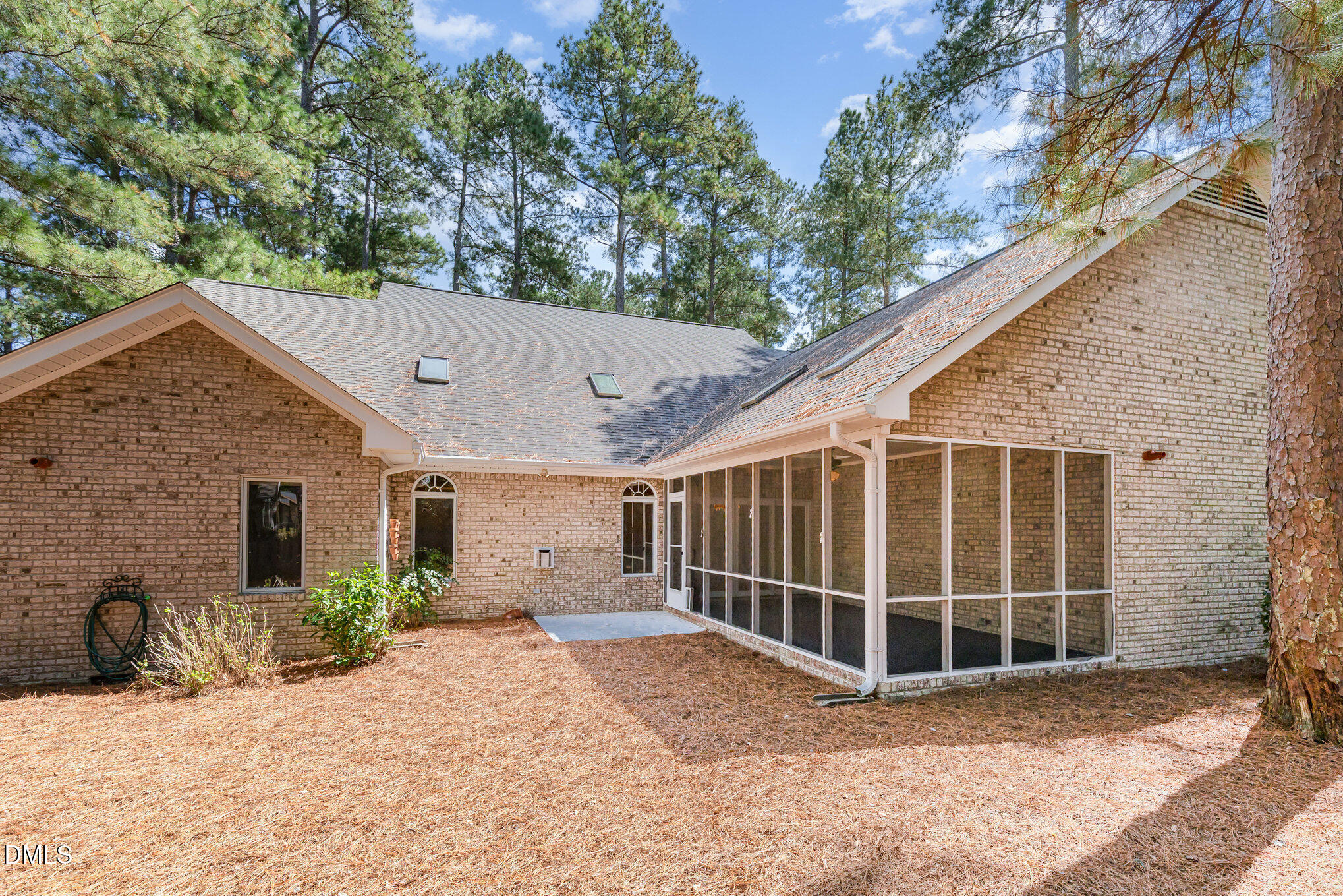 5 Pinyon Lane Pinehurst, NC 28374 - Photo 34 of 37 a view of a house with a backyard and porch