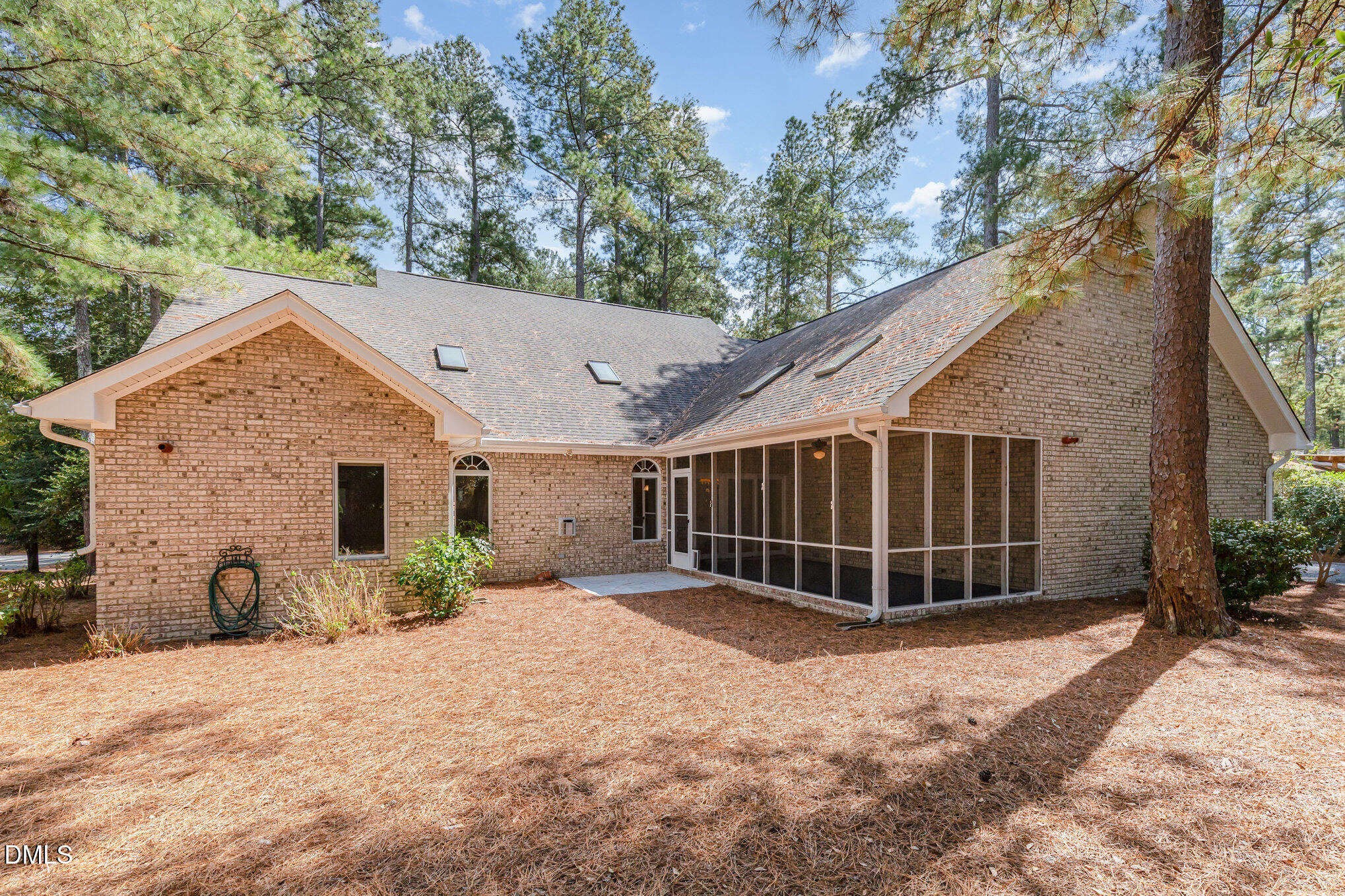 5 Pinyon Lane Pinehurst, NC 28374 - Photo 35 of 37 a view of backyard with potted plants and a large tree