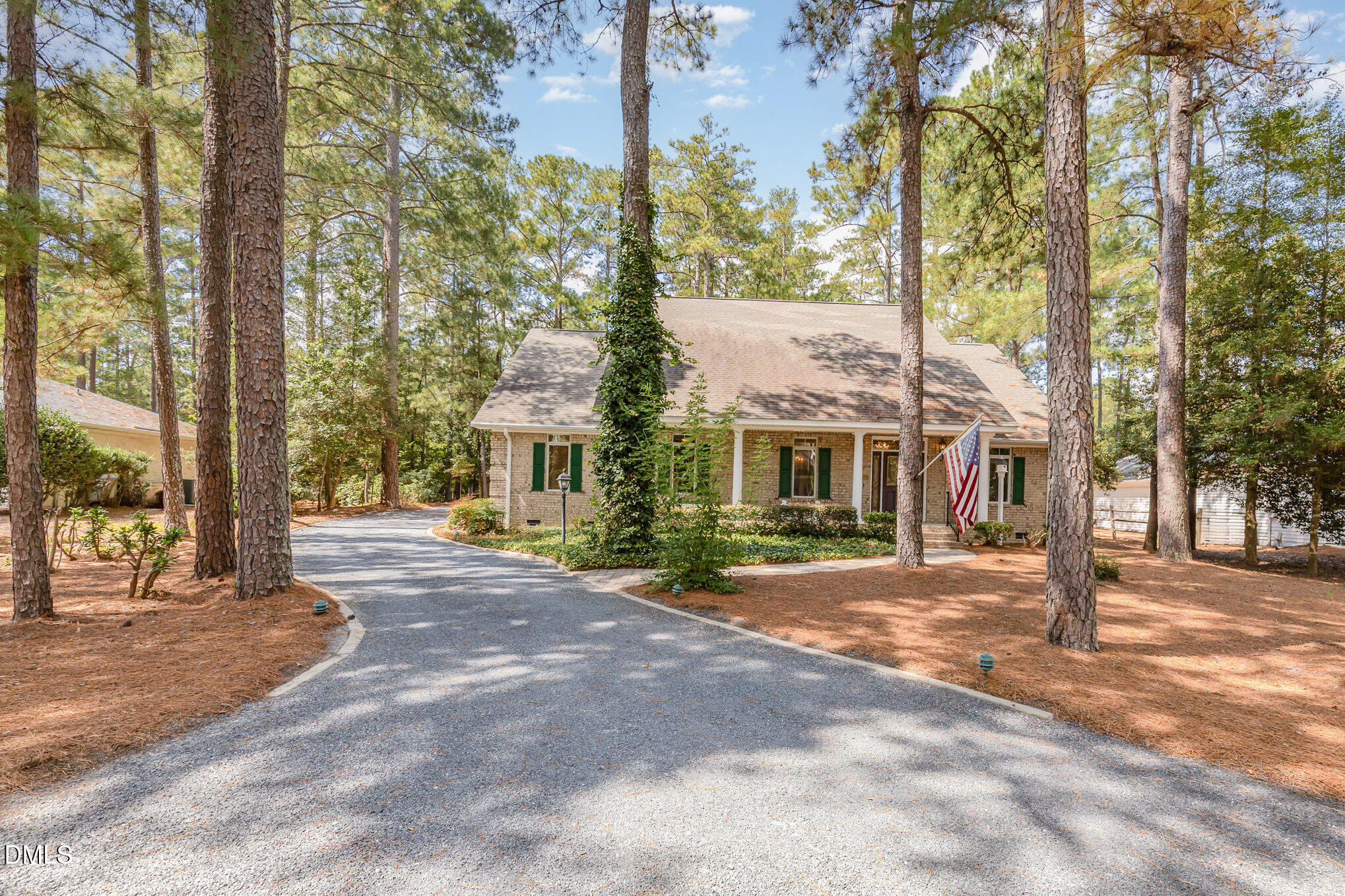 5 Pinyon Lane Pinehurst, NC 28374 - Photo 6 of 37 a view of a large house with a street