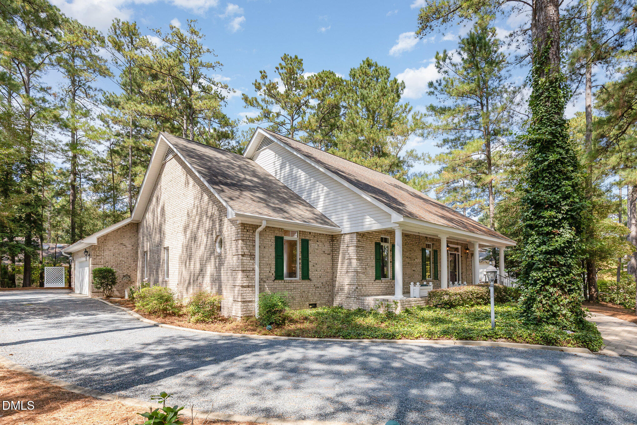 5 Pinyon Lane Pinehurst, NC 28374 - Photo 8 of 37 a front view of a house with garden