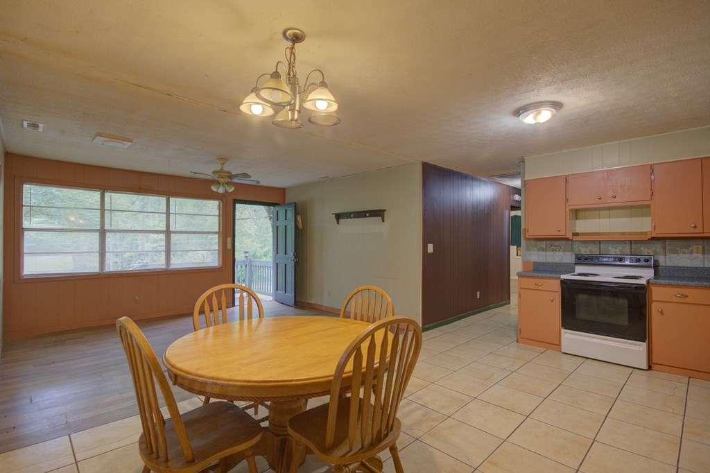 92 No-Where Road Blairsville, GA 30512 - Photo 5 of 36 a view of a dining room with furniture window and outside view
