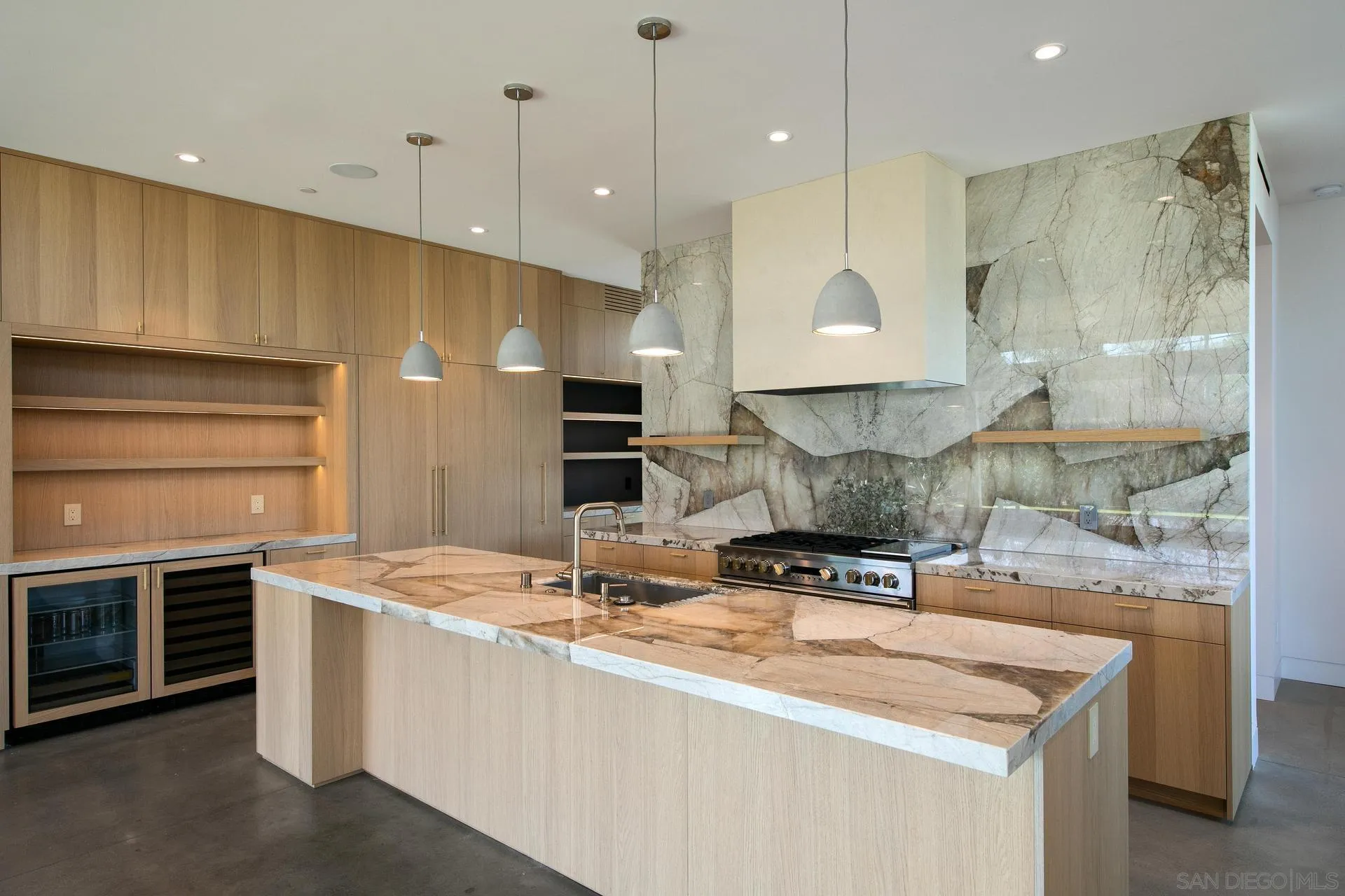 664 Cornish Drive Encinitas, CA 92024 - Photo 34 of 49 a kitchen with stainless steel appliances granite countertop a sink a stove and a refrigerator