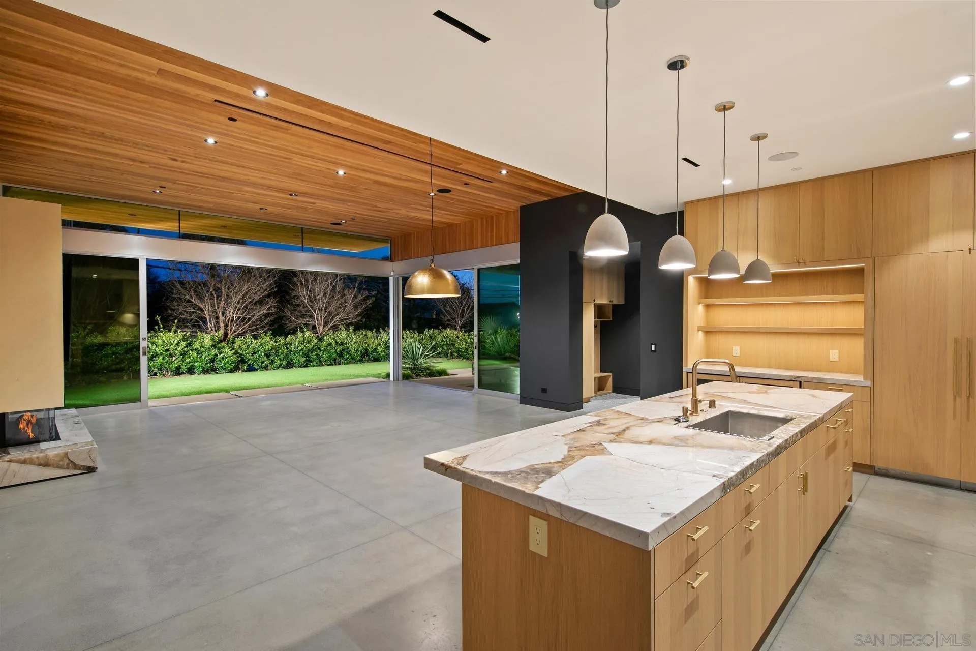 664 Cornish Drive Encinitas, CA 92024 - Photo 35 of 49 a kitchen with a stove a refrigerator and a fireplace