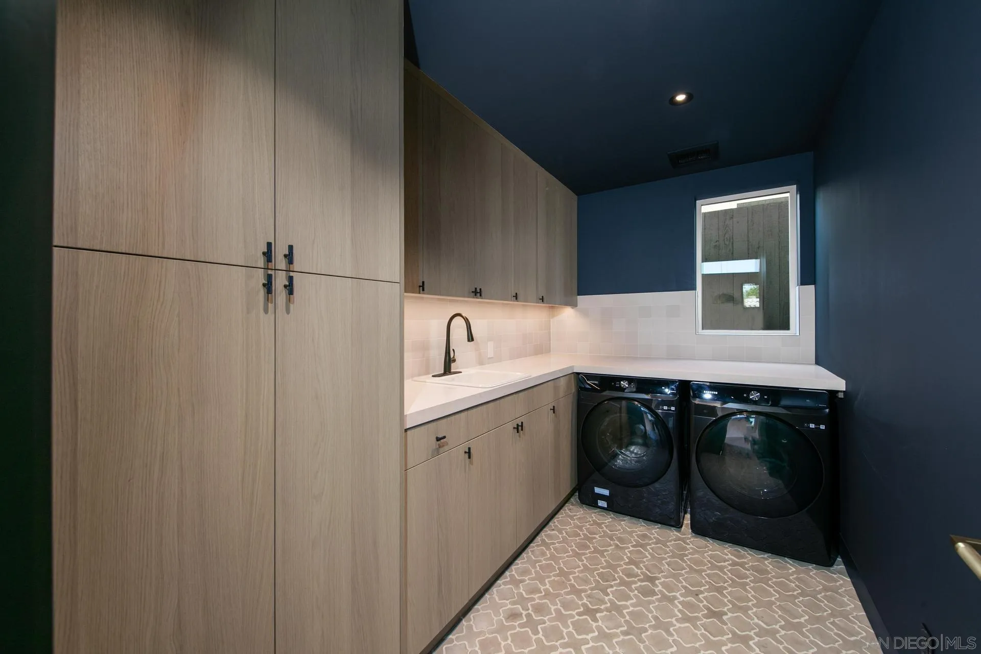 664 Cornish Drive Encinitas, CA 92024 - Photo 40 of 49 a utility room with a sink a washer and dryer