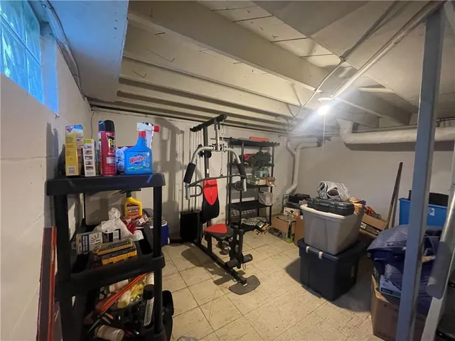 a view of a storage room with furniture gym equipment