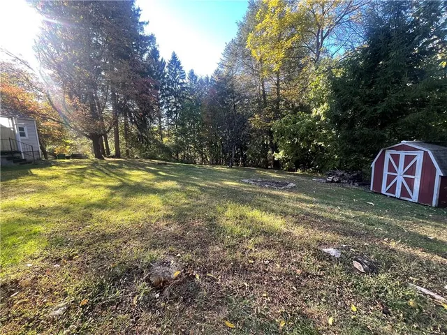 a view of outdoor space with trees all around