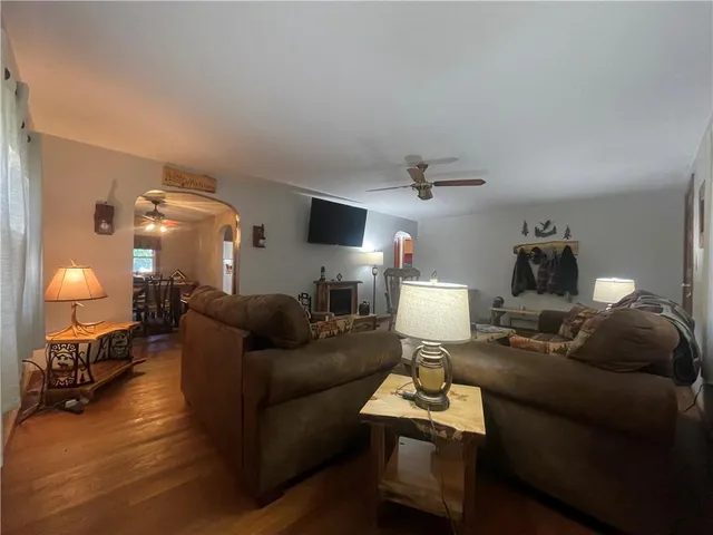 a living room with furniture and a lamp