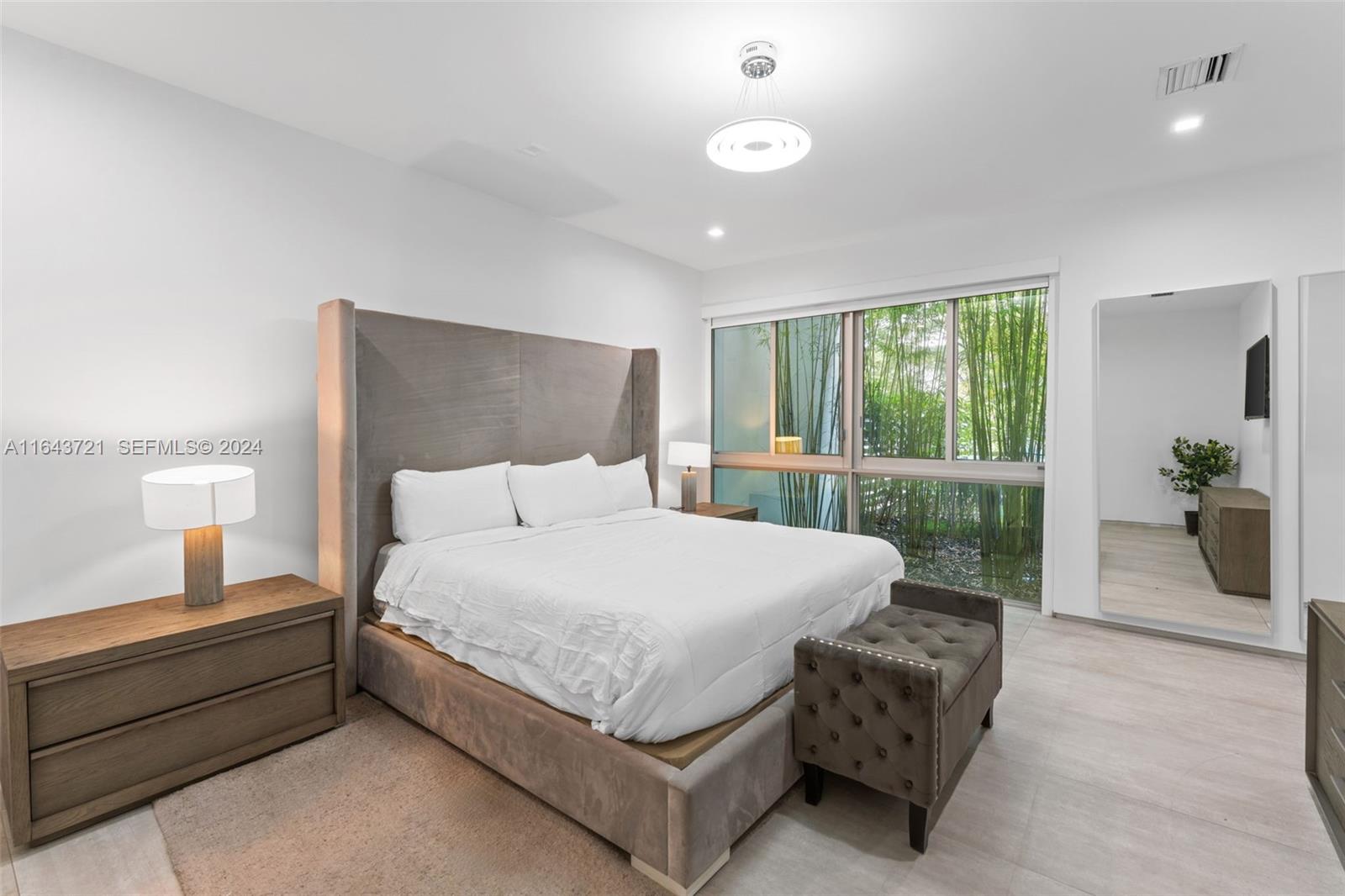 1510 Southwest 4th Avenue Miami, FL 33129 - Photo 16 of 46 a bed sitting in a spacious bedroom next to a window