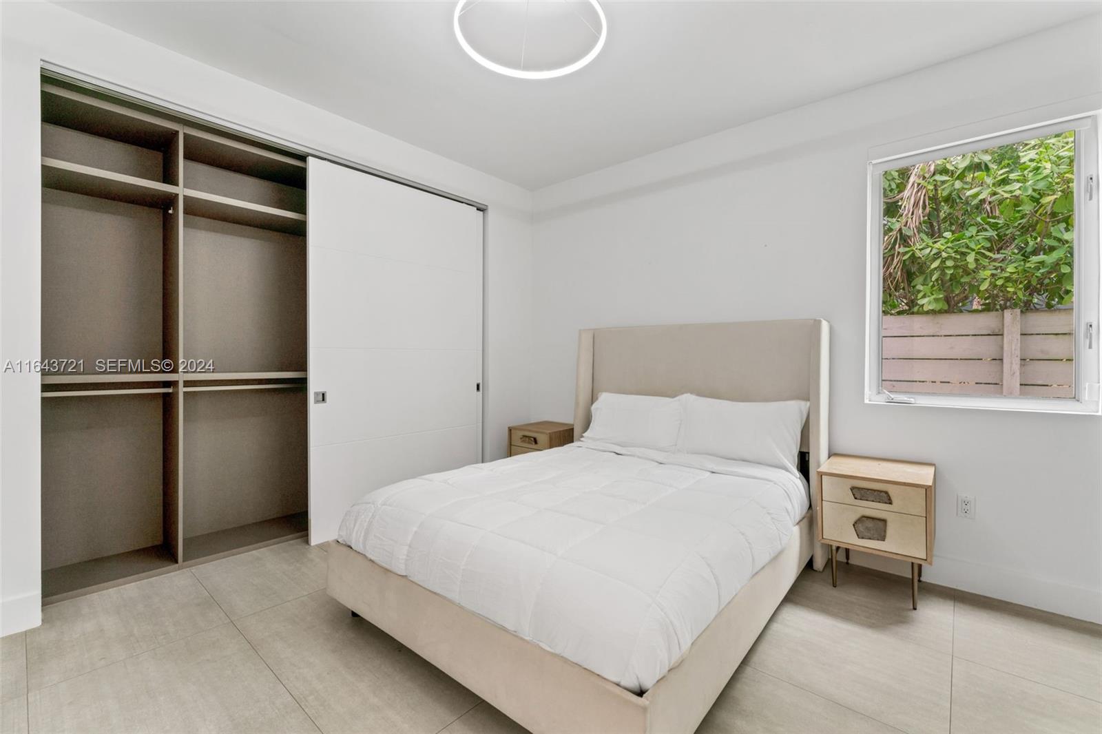 1510 Southwest 4th Avenue Miami, FL 33129 - Photo 20 of 46 a bedroom with a bed and a window