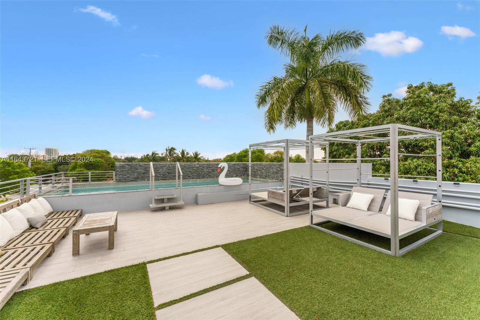 1510 Southwest 4th Avenue Miami, FL 33129 - Photo 32 of 46 a view of a swimming pool with lounge chairs