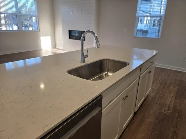 a kitchen with a sink and cabinets