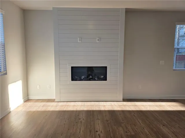 a view of a livingroom with wooden floor