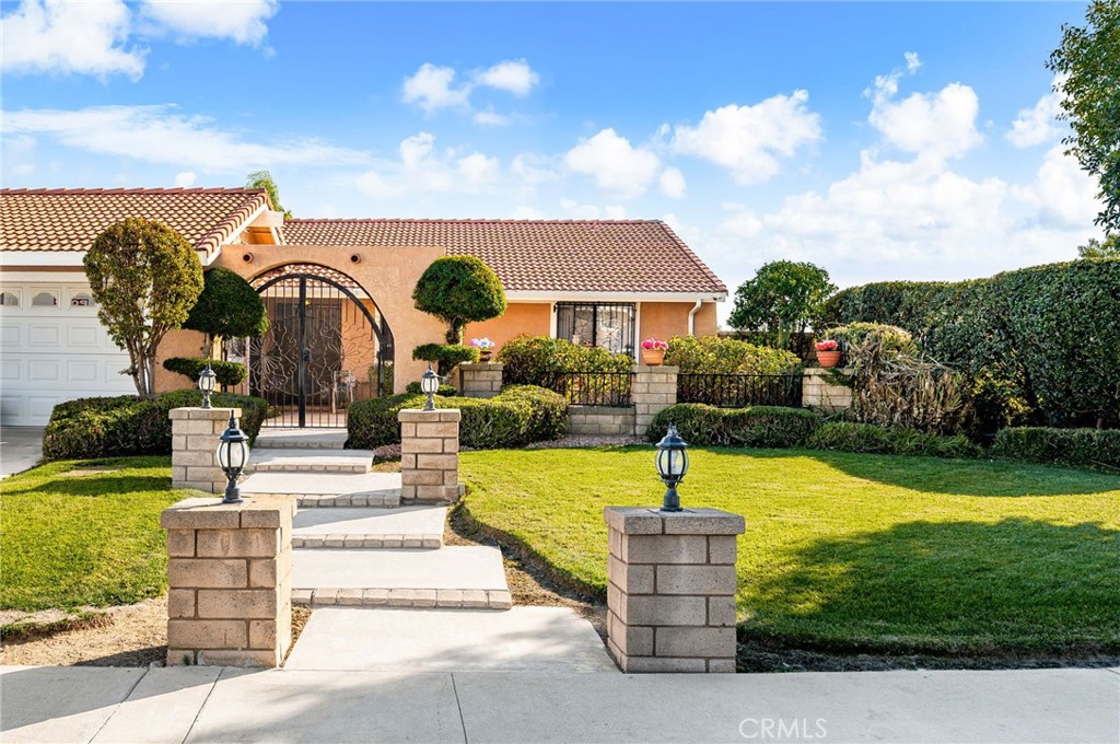 9637 Apricot Avenue Rancho Cucamonga, CA 91737 - Photo 1 of 44 a swimming pool with some trees in the background