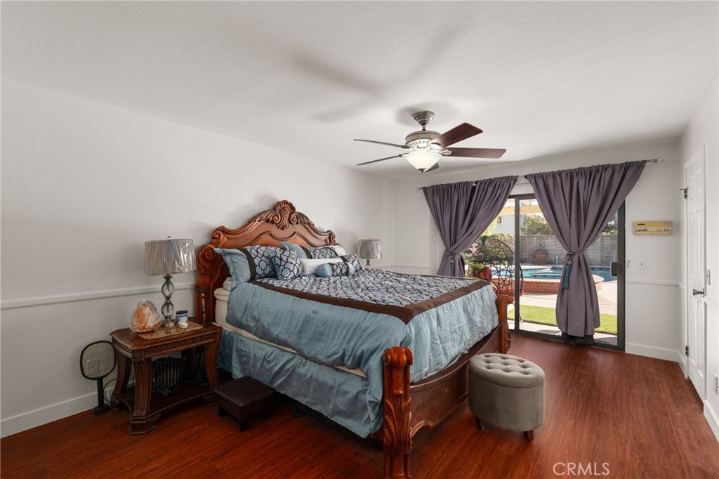 9637 Apricot Avenue Rancho Cucamonga, CA 91737 - Photo 19 of 44 a bedroom with a bed and a chandelier