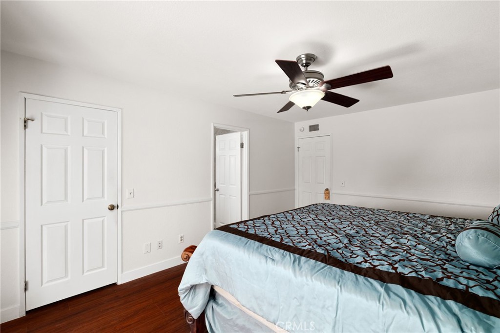 9637 Apricot Avenue Rancho Cucamonga, CA 91737 - Photo 20 of 44 a bedroom with a bed and a ceiling fan