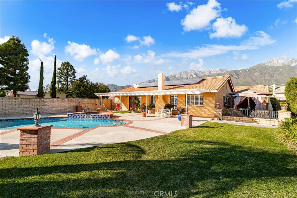 9637 Apricot Avenue Rancho Cucamonga, CA 91737 - Photo 2 of 44 a view of a house with swimming pool and sitting area