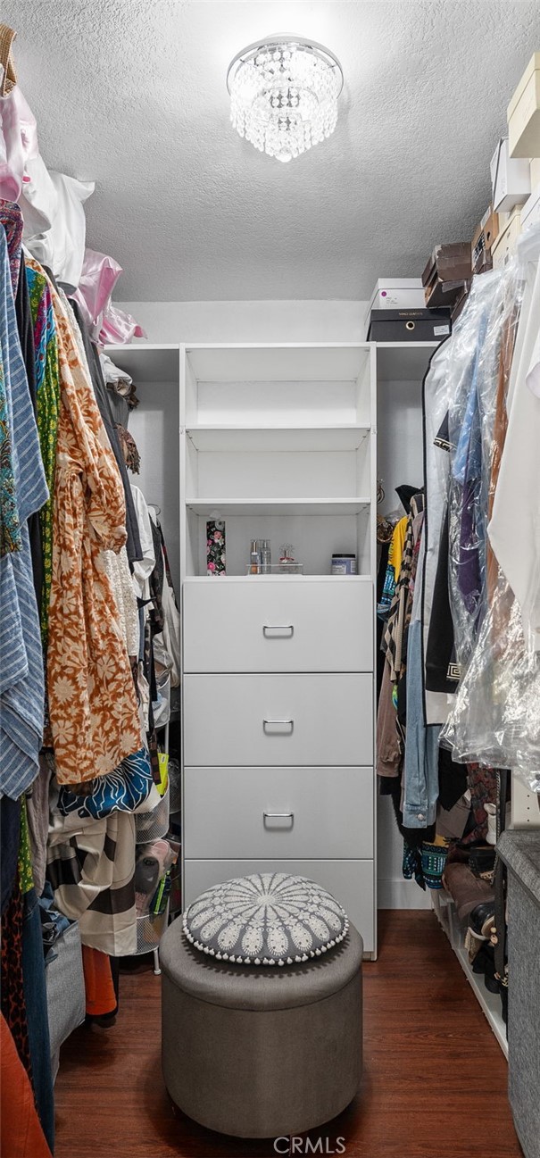 9637 Apricot Avenue Rancho Cucamonga, CA 91737 - Photo 23 of 44 a view of walk in closet with clothes and shoes
