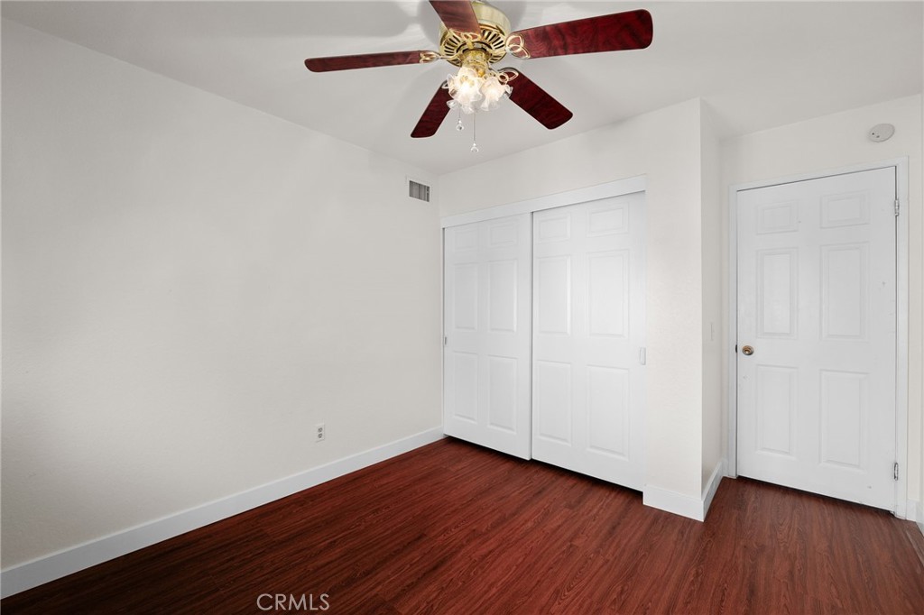 9637 Apricot Avenue Rancho Cucamonga, CA 91737 - Photo 25 of 44 a view of an empty room with wooden floor