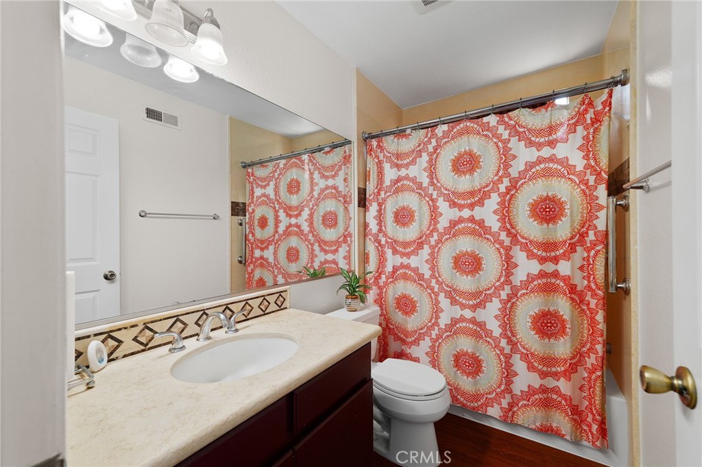 9637 Apricot Avenue Rancho Cucamonga, CA 91737 - Photo 26 of 44 a bathroom with a sink and a mirror