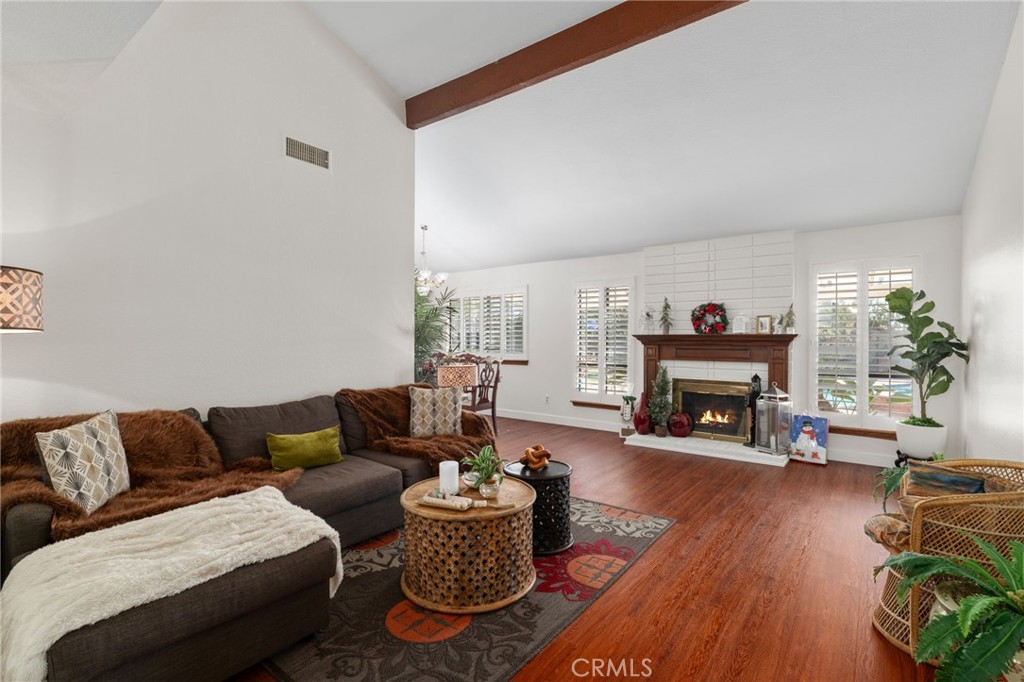 9637 Apricot Avenue Rancho Cucamonga, CA 91737 - Photo 9 of 44 a living room with furniture and a fireplace