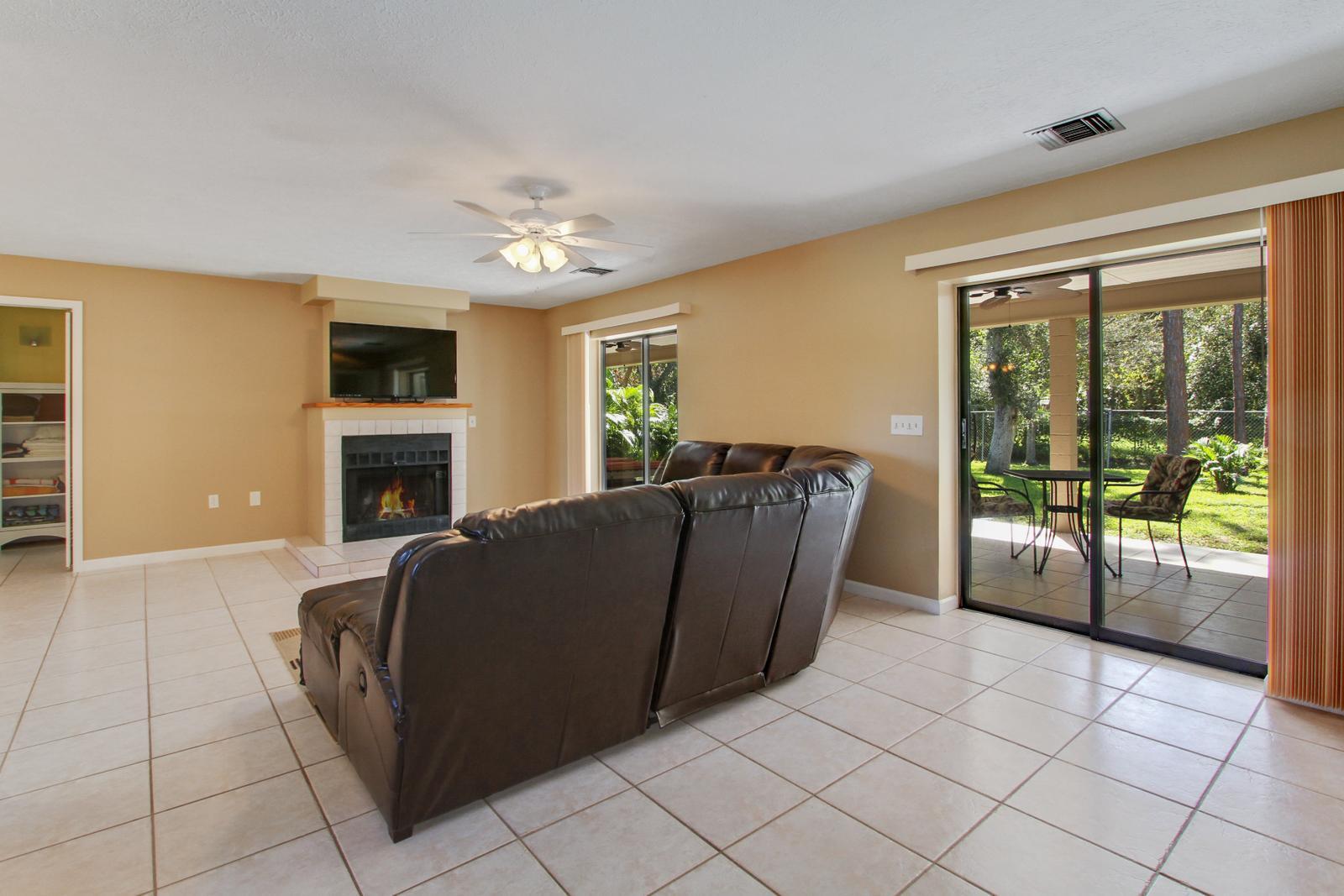 7807 Pensacola Road Fort Pierce, FL 34951 - Photo 5 of 25 Living Room with Fireplace