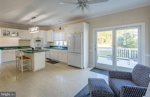 a living room with fireplace furniture and a flat screen tv