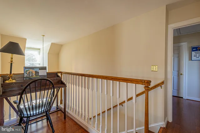 a bedroom with furniture and a large window