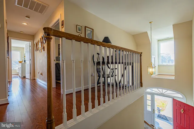 a living room with furniture a couch and dresser