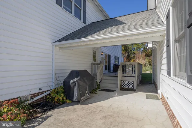 a bathroom with a granite countertop shower sink and toilet