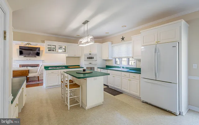 a living room with furniture fireplace and a window