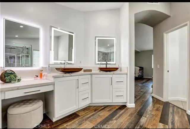 a bedroom with a bed and a table in it