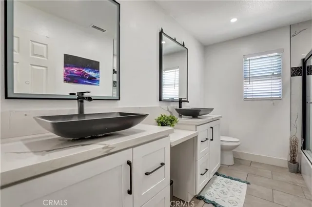 a view of a livingroom with furniture and a window