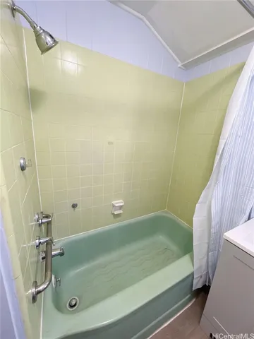 a bathroom with a shower and a bathtub