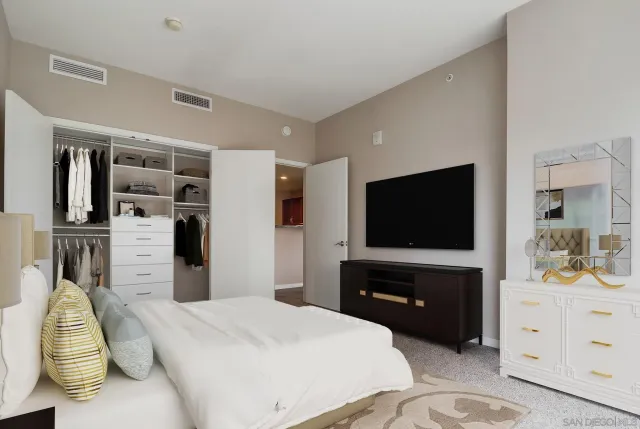 a view of a hallway with bathroom and utility room