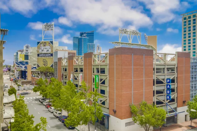 a living room with furniture and large windows