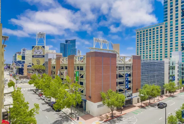 a building outdoor space with patio furniture and potted plants