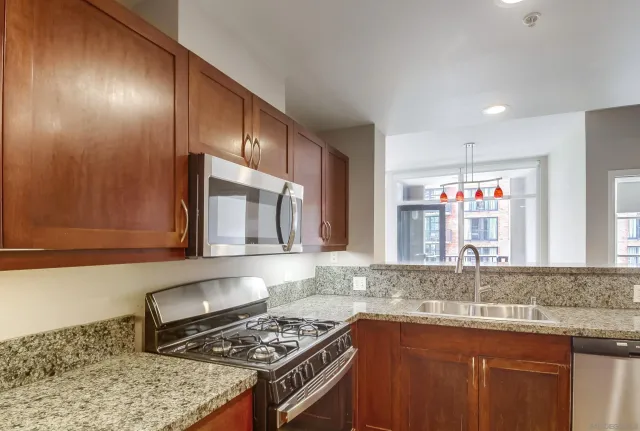 a living room with furniture wooden floor and a flat screen tv
