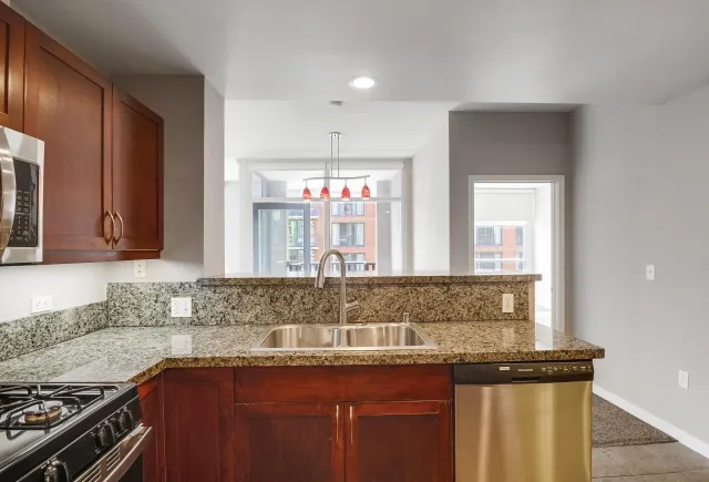 a view of a dining room with furniture and a large window